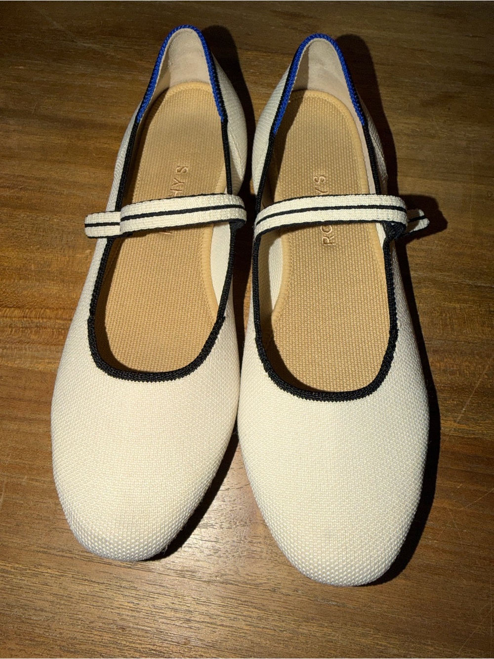 Rothy's Cream Mary Jane Flats with Black Trim and Blue Heel Accent